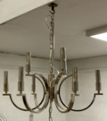 A contemporary chrome plated nine branch pendent light fitting, complete with chain and rose,