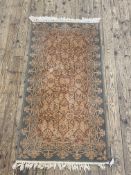 A Persian style machine-loomed runner rug 170cm x 84cm.