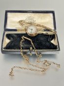A vintage ladys 9ct gold wrist watch with silvered dial on expanding gilt metal bracelet a/f and a