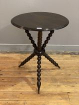 A late Victorian mahogany gipsy table, the circular moulded top raised on three bobbin turned