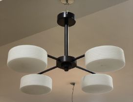 A contemporary ceiling pendent light fitting, four opaline glass shades of ribbed cylindrical form