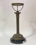 An Edwardian cast brass Corinthian columnar oil lamp base, with later lustre style glazed ceramic