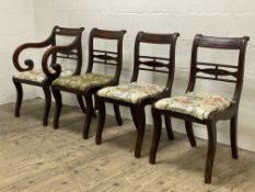 A set of four (3+1) Regency mahogany dining chairs, with carved crest rail over ball pattern rail