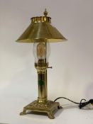 A vintage brass table lamp formed as an oil lamp, with badge reading 'Paris Istanbul, The Orient