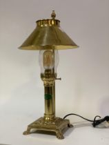 A vintage brass table lamp formed as an oil lamp, with badge reading 'Paris Istanbul, The Orient