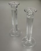 A pair of Lindean Mill Selkirk clear hand blown glass column table candle sticks with vertical