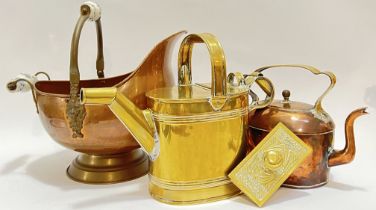 A group of copper and brassware comprising a ceramic handled copper coal scuttle (h- 34cm, w- 36cm),