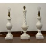 A pair of modern alabaster lamps of baluster form, (H39cm) together with a similar spiral moulded