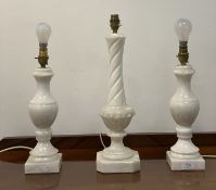 A pair of modern alabaster lamps of baluster form, (H39cm) together with a similar spiral moulded