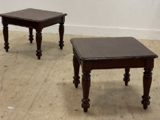 A pair of Victorian style mahogany lamp tables, each with square top above baluster carved and