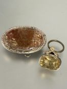 A 19thc yellow metal mounted seal in rococo style set with citrine carved with monogram with chips