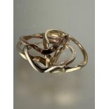 A three colour metal four ring puzzle ring Q 7.23g