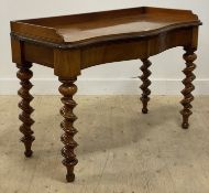 A Victorian mahogany and walnut serpentine console table, the galleried top above two frieze