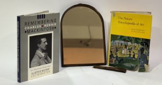 An arched wooden wall hanging/table top mirror together with "Remembering Charles Rennie