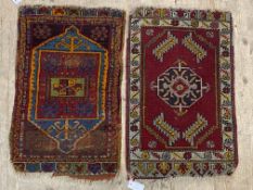 A small hand knotted Turkish rug, the red field with octagonal medallion and bordered (82cm x