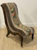 A Victorian Aesthetic walnut framed scroll back chair, upholstered in needlepoint fabric worked in a