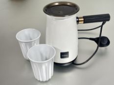 A Hotel Chocolat hot chocolate velvetiser set in unused condition in white enamel and bronzed