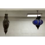 A Moroccan style coloured glass pendent light fitting of compressed spherical form, complete with