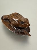 Property of the late Countess Haig, a carved Chinese hardwood Netsuki of a frog on leaf with
