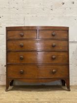 Early 19th century bowfront chest, the frieze with ebonised string inlay above two short and three