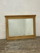 A contemporary light oak framed over mantel mirror. 120cm x 90cm.