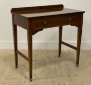 An Edwardian mahogany console table, the ledge back above a drawer with herringbone inlay, raised on