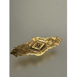 A Victorian 15ct gold bar brooch with beaded and rope pattern border and glazed panel verso no signs