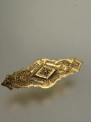 A Victorian 15ct gold bar brooch with beaded and rope pattern border and glazed panel verso no signs