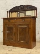 A mid 19th century mahogany chiffonier, the raised mirror back with open shelf supported by ring