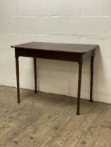 A George III mahogany console table, the rectangular top with rounded corners above a plain frieze