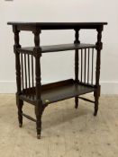 An early 20th century oak side table, the rectangular top raised on turned supports united by two