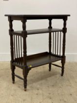 An early 20th century oak side table, the rectangular top raised on turned supports united by two