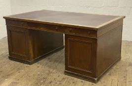 A Late Victorian oak twin pedestal partners desk, the top inset with skivered writing surface, above