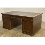 A Late Victorian oak twin pedestal partners desk, the top inset with skivered writing surface, above