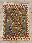 A small chobi kilim rug. 88cm x 63cm.