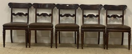 A set of five William IV mahogany dining chairs, the curved crest rail carved in low relief with