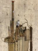 Fishing interest: a collection of six vintage fishing rods, including a Hardy Bros 'The gold