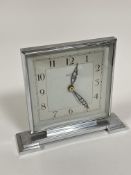 A 1930s chrome plated Bentima square dial mantle clock with silvered dial on stepped base movement