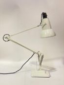 A vintage anglepoise lamp by Herbert Terry & Sons, on a stepped square base, stamped by maker