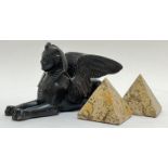 A cast metal bronze-patinated winged sphinx (h- 10cm, w- 18cm), together with a pair of travertine