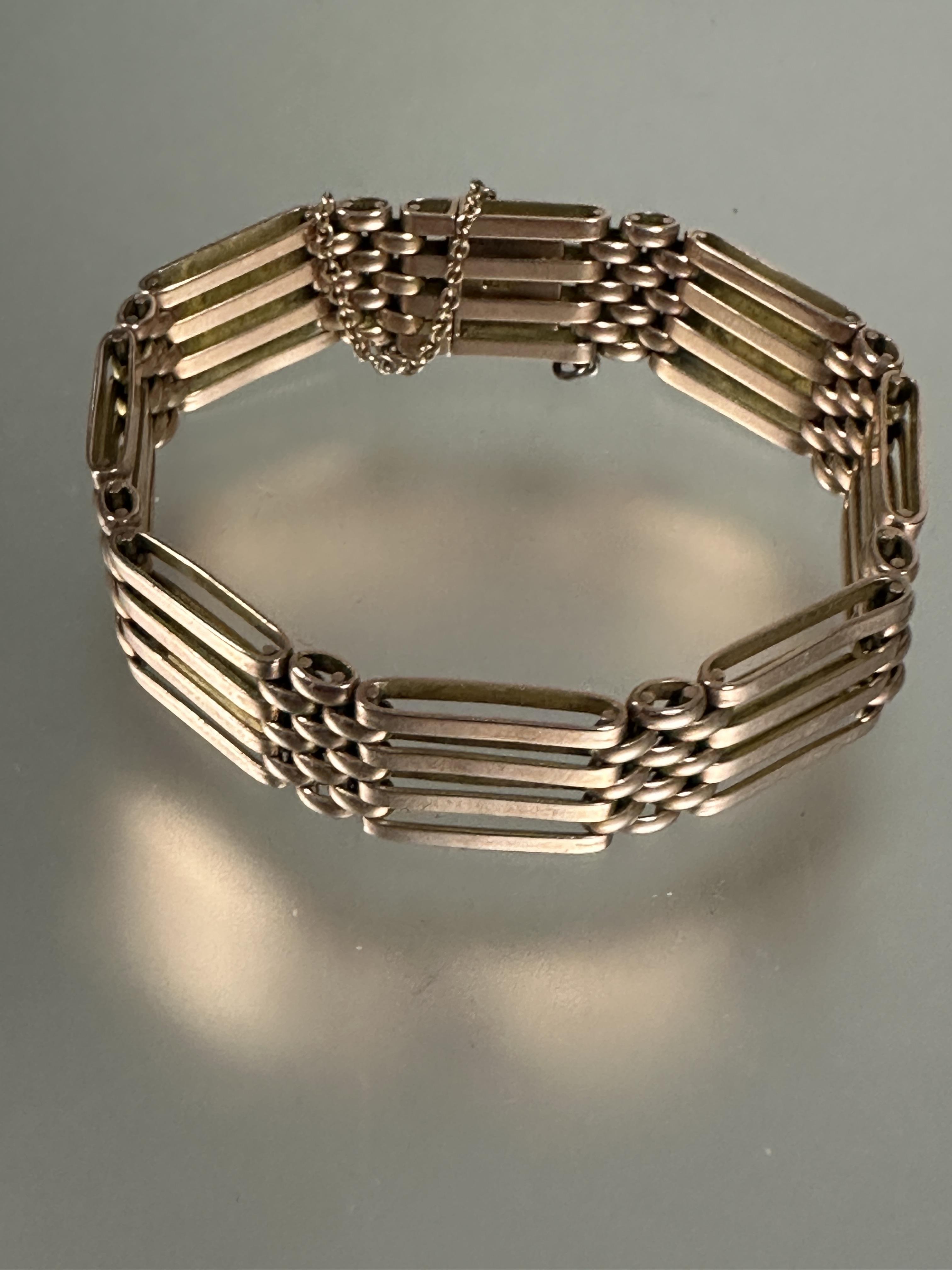 A 9ct rose gold gate link bracelet with clip fastening and safety chain no signs of damage or - Image 2 of 2