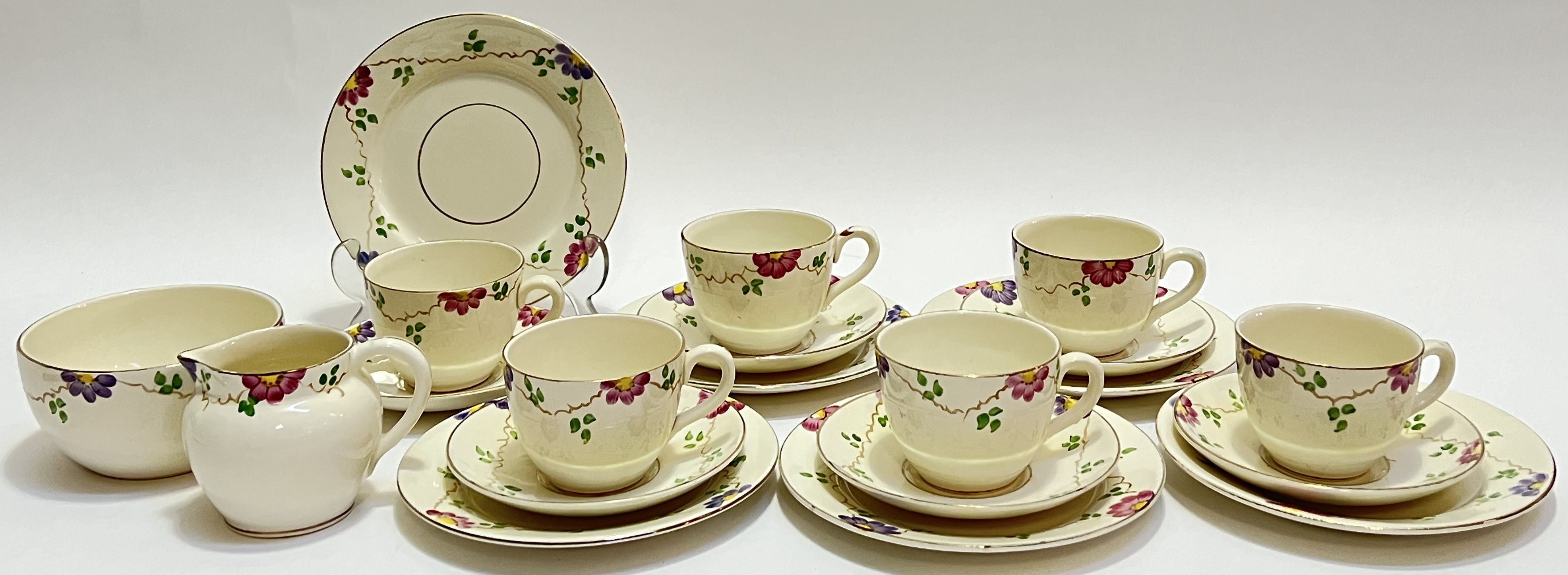 A George Jones & Sons part tea service with hand painted floral design, comprising six tea plates (