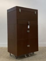 A contemporary leather bound steamer type vanity / bedroom cabinet, the hinged top opening to a