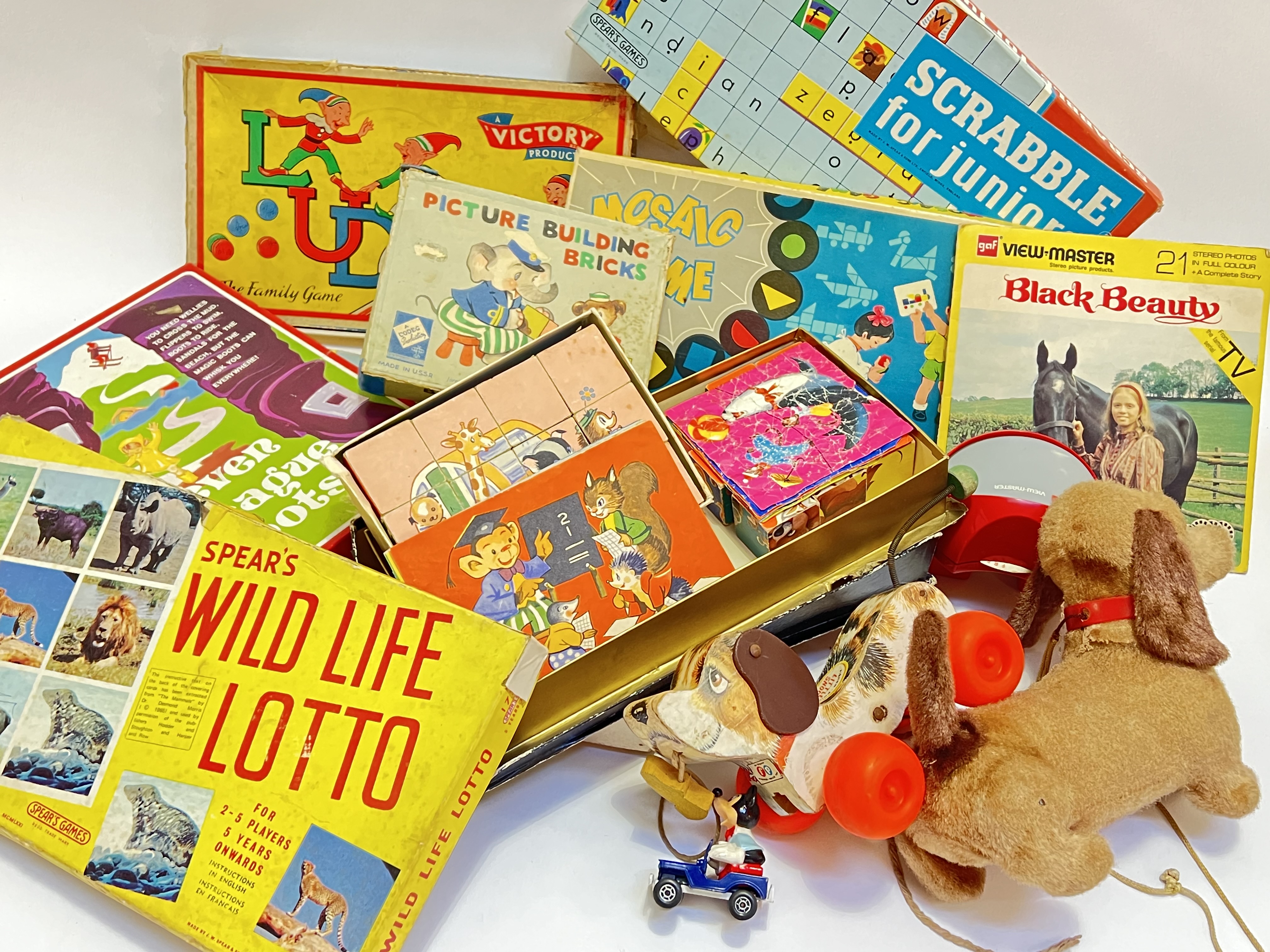 A quantity of vintage board games and toys comprising Scrabble, Ludo, Spear's Wild Life Lotto,