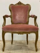A French style giltwood fauteuil or armchair, with acanthus carved crest rail, pink drylon
