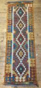 A Chobi kilim runner rug of geometric design 204cm x 65cm