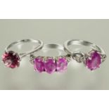 A group of three silver pink stone set dress rings N 9.46g (3)
