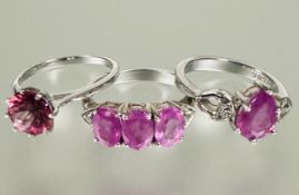A group of three silver pink stone set dress rings N 9.46g (3)