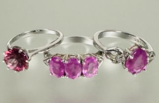 A group of three silver pink stone set dress rings N 9.46g (3)