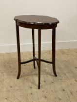 An Edwardian boxwood strung mahogany serpentine centre table. H73cm.